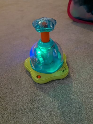 Bright Starts Press and Glow spinner