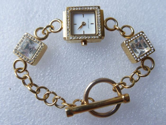 Pieces gold tone bracelet watch with crystal detail