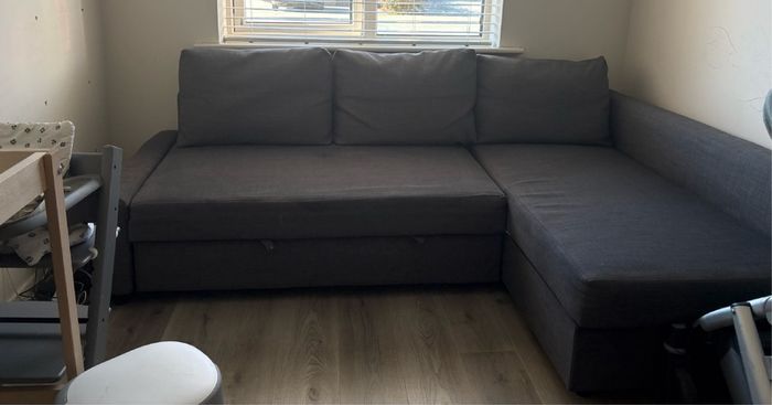 Corner sofa-bed with storage, dark grey