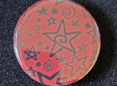 Star, pin back button badge.