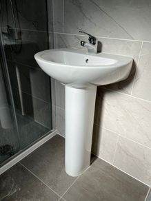basin with pedestal and tap