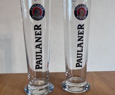 Two Paulaner pint glasses