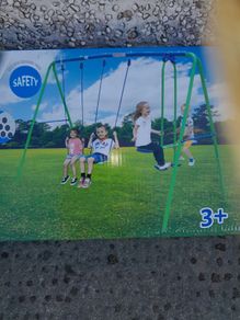 Double swing Set and Glider, brand new in a box.
