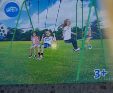 Double swing Set and Glider, brand new in a box.