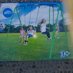 Double swing Set and Glider, brand new in a box.