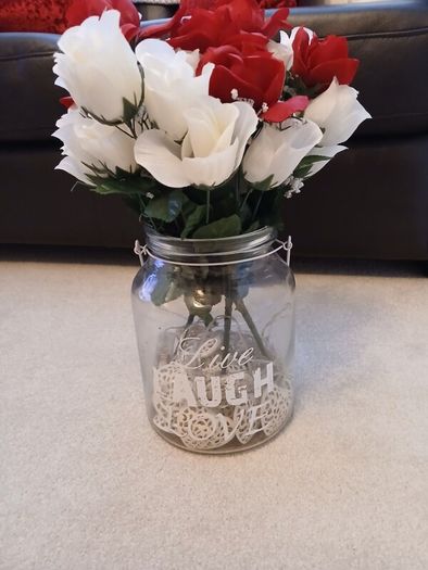 vase with artifical flowers and lights