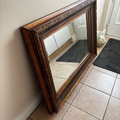 Large ornate wooden mirror