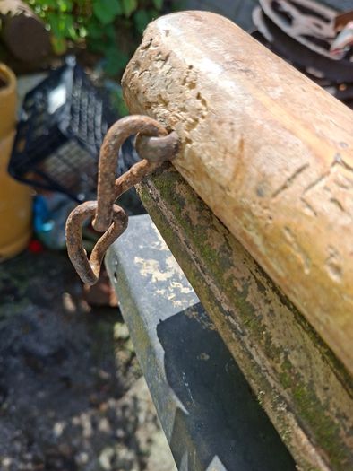 This Antique 19th Century Wooden Single Tree used to connect a Horse or Ox to Farm Equipment. The item features handmade wooden construction with blacksmith-forged iron hook Stage or Movie Props