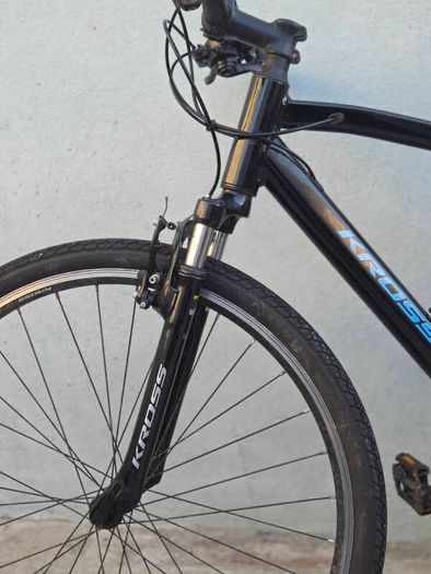Two bikes one mountain one is a type of racing mountain bike