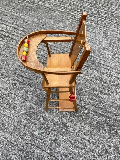 Vintage wooden doll high chair FROM THE 1930S featuring a built-in play tray with a wire bead