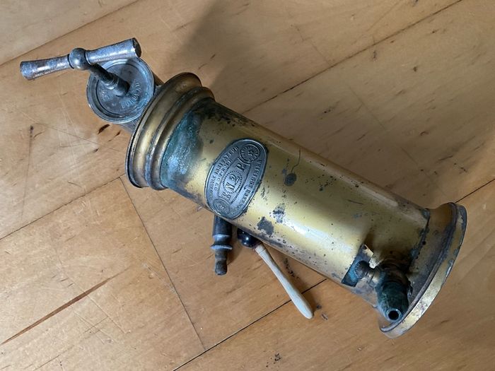 This is an antique  Dr. Eguisier brass irrigator, a medical instrument patented in 1843.
