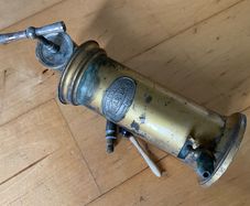 This is an antique  Dr. Eguisier brass irrigator, a medical instrument patented in 1843.