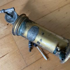 This is an antique  Dr. Eguisier brass irrigator, a medical instrument patented in 1843.