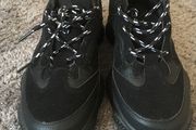 Black trainers bought in Boutique in London
