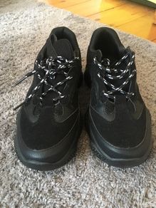 Black trainers bought in Boutique in London