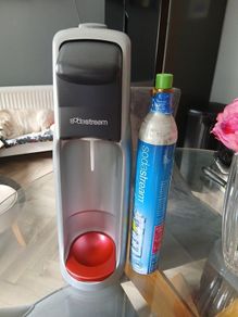 Grey & red Soda stream machine (with empty gas bottle)