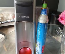 Grey & red Soda stream machine (with empty gas bottle)