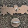 Roll up ,  pin back badge. Image 2