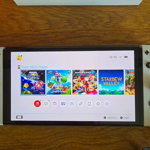 Nintendo Switch OLED (plus 3 games and travel case)