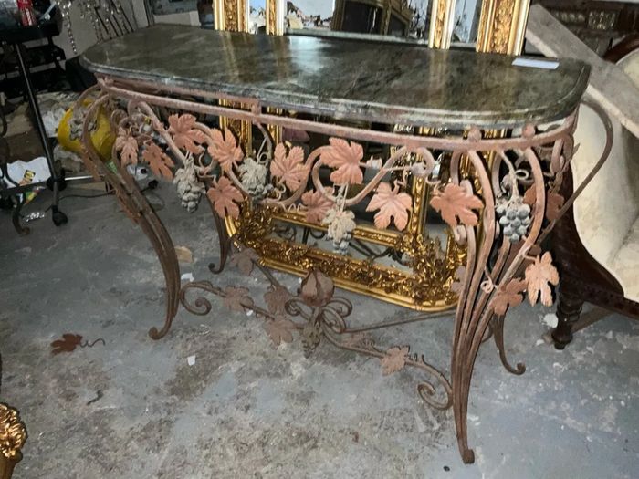 This is an old wrought iron, console table