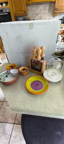 Cheese knife set with magnetic base 15.00 euro, Pottery/Terra Cotta Bowl w/side Section, Olive Pattern, Portugal and 2 small bowl  18.00 euro.,.Ceramic Garlic Lemon Grater Plate Hand Painted 12.00 euro.,Glass display small dome with white carmic tea light