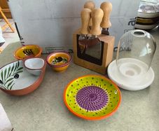 Cheese knife set with magnetic base 15.00 euro, Pottery/Terra Cotta Bowl w/side Section, Olive Pattern, Portugal and 2 small bowl  18.00 euro.,.Ceramic Garlic Lemon Grater Plate Hand Painted 12.00 euro.,Glass display small dome with white carmic tea light