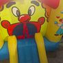 Happy Hop clown-themed bouncy castle with blower Image 6