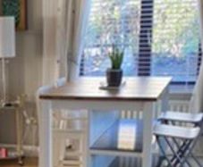 IKEA Free-standing kitchen island with foldable chairs.