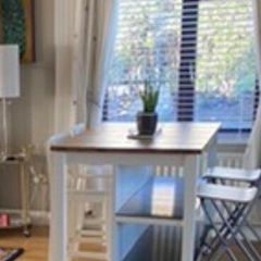 IKEA Free-standing kitchen island with foldable chairs.