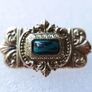 Vintage gold tone brooch with Green Faceted Stone Image 2