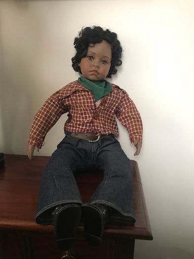 Lifelike doll in cute western clothes