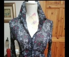 Beautiful silk lightweight material with buttons front long sleeves. Like new.