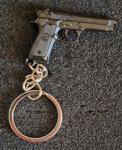 Keyring, firearms, baretta, luger, mauser,sig sauer, colt.
