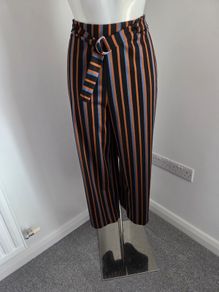 New. Size XL. Fits 10 to 14. Pieces wide leg belted striped trousers.