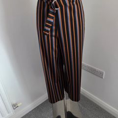 New. Size XL. Fits 10 to 14. Pieces wide leg belted striped trousers.