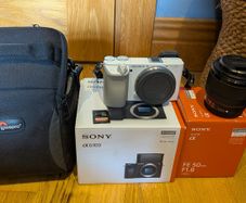White Sony A6100 + Sony 50mm F1.8 Lens, Lowepro Bag & SD Card