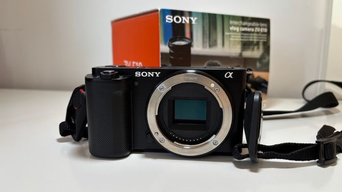 Sony ZVE-10 + Sony E 18-105mm f/4 lens (cage and 5 batteries)
