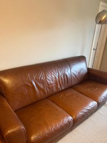 brown leather couch and chair