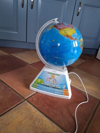 Kids touch globe