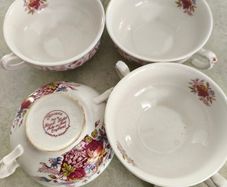 SET OF 4 SOUP BOWLS  the Staffordshire Potteries in Stoke-on-Trent, England. The text "Flowers Made by Royal Tudor Stoke-on-Trent England