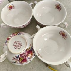 SET OF 4 SOUP BOWLS  the Staffordshire Potteries in Stoke-on-Trent, England. The text "Flowers Made by Royal Tudor Stoke-on-Trent England