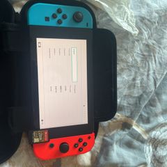 nintendo switch 1 with legends of Zelda breath of the wild and doc