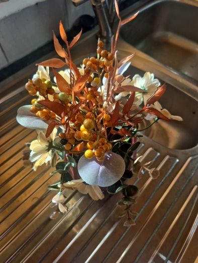 Small orange and tan fake flowers