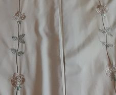 A pair of vintage embroidered curtains