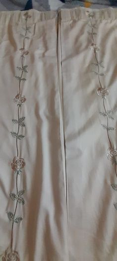 A pair of vintage embroidered curtains