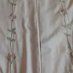 A pair of vintage embroidered curtains