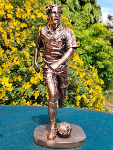 Two Gilded footballers