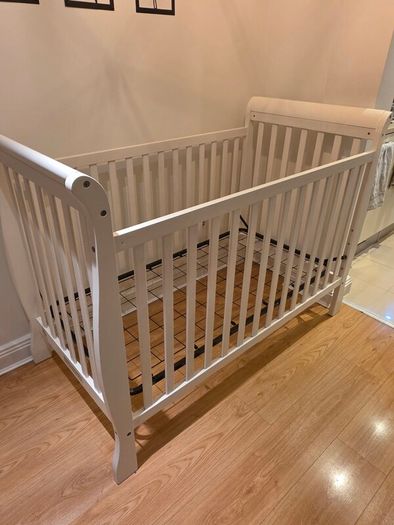 sleigh-style  baby crib and changing table