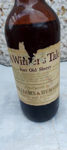 vintage bottle of winters tale sherry 3/4 full ,found in a old pub closed down,