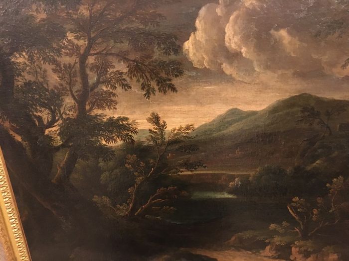 Circle of Francesco Zuccarelli  mountainous landscape by a lake with a fortress